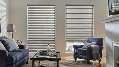 Gray banded shades, one open and one closed, in a living room.